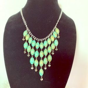 Fashion bib necklace in turquoise and gold patina